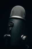 black and silver microphone with black background