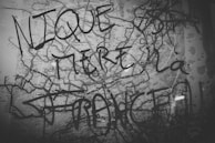 A hand-drawn map overlay on a city street photo, blending cartography and artistic interpretation.