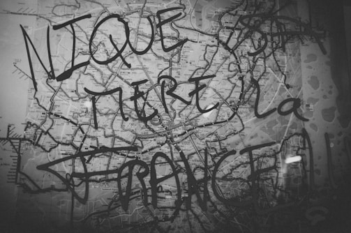 A delicate pencil drawing overlaying a map fragment, highlighting invisible urban contours and forgotten pathways.