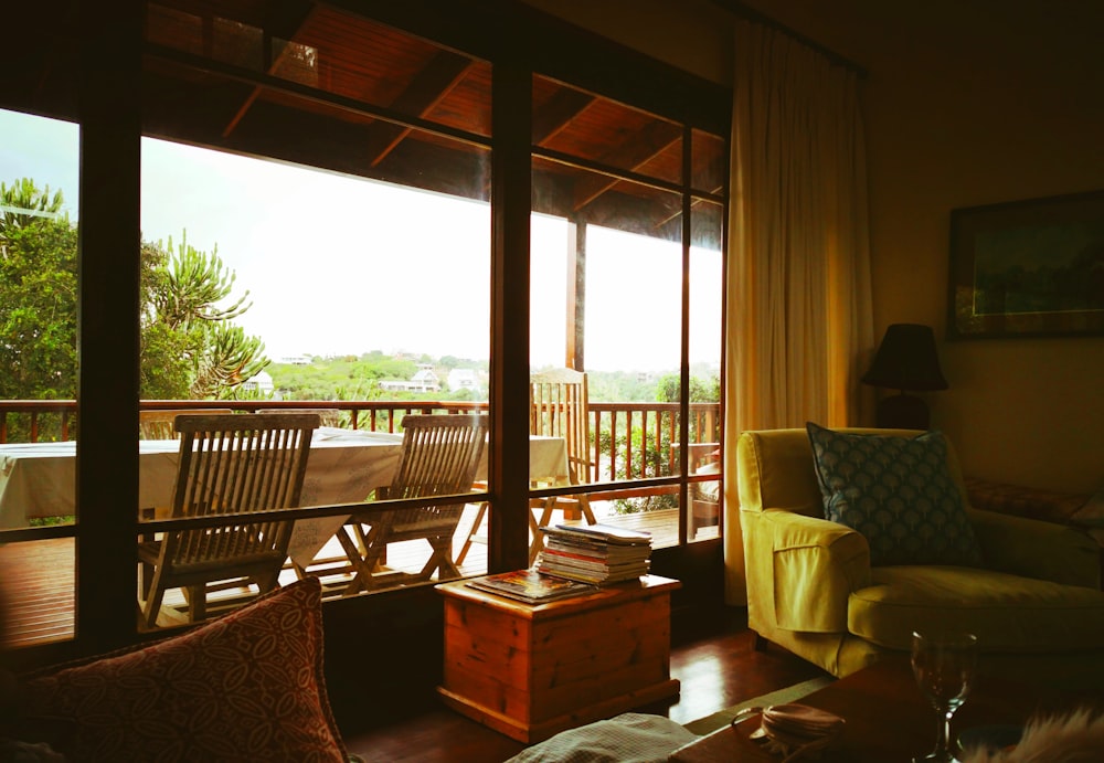 brown wooden table near brown wooden armchair