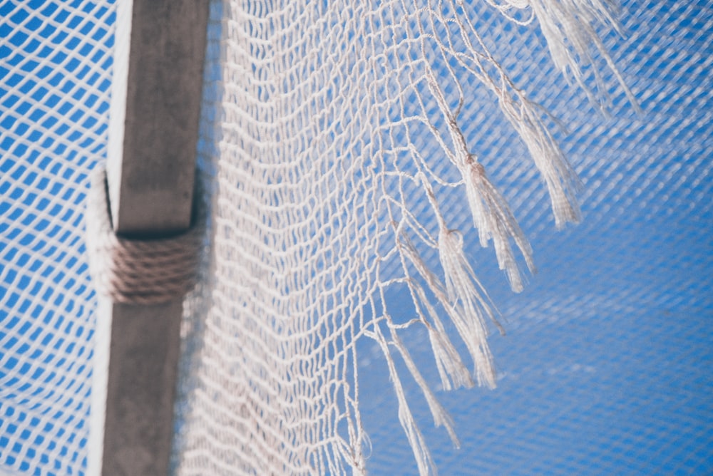 white net on blue textile