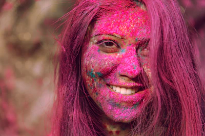 Vibrant hair colors displayed on a smiling woman after a fresh dye.