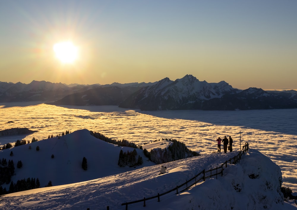 people walking on snow covered ground during daytime