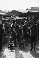 An urban scene with people interacting in a lively market.