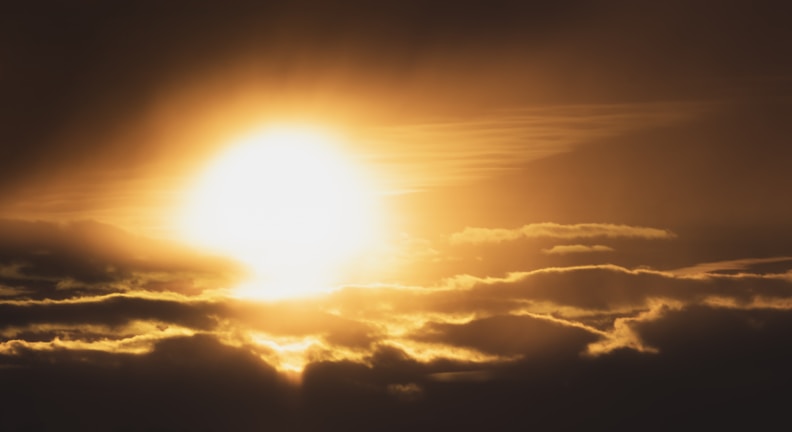 An abstract image of light breaking through clouds, symbolizing hope.