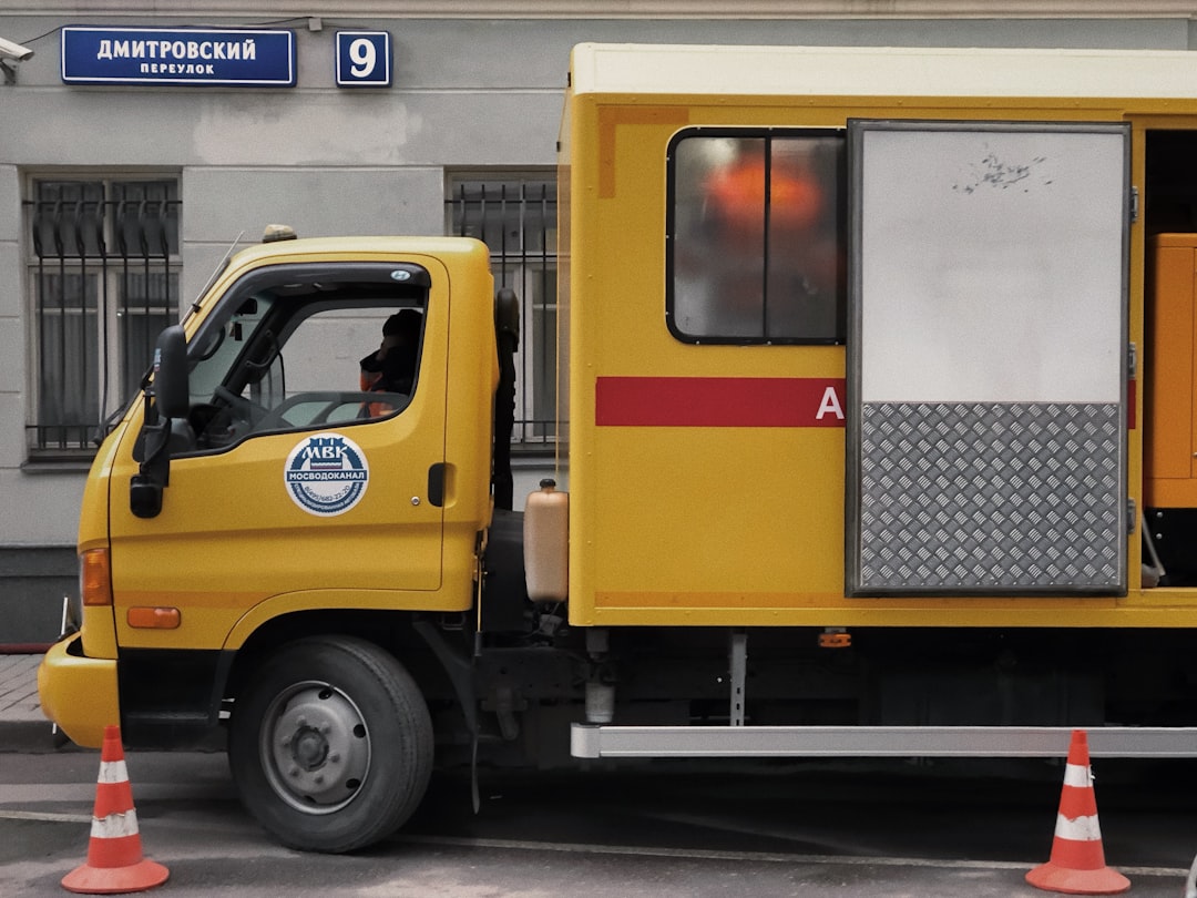 yellow and white truck on road during daytime