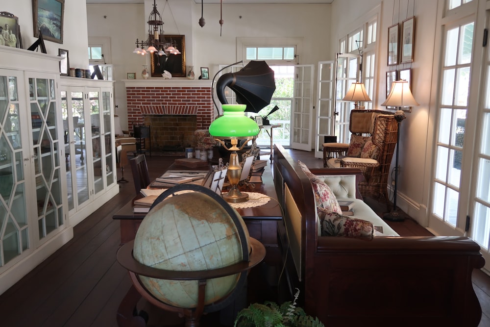 blue and green desk globe on brown wooden table