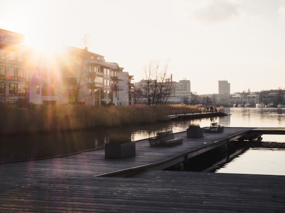 Sunset over Porto’s historic waterfront with modern condos glowing warmly.