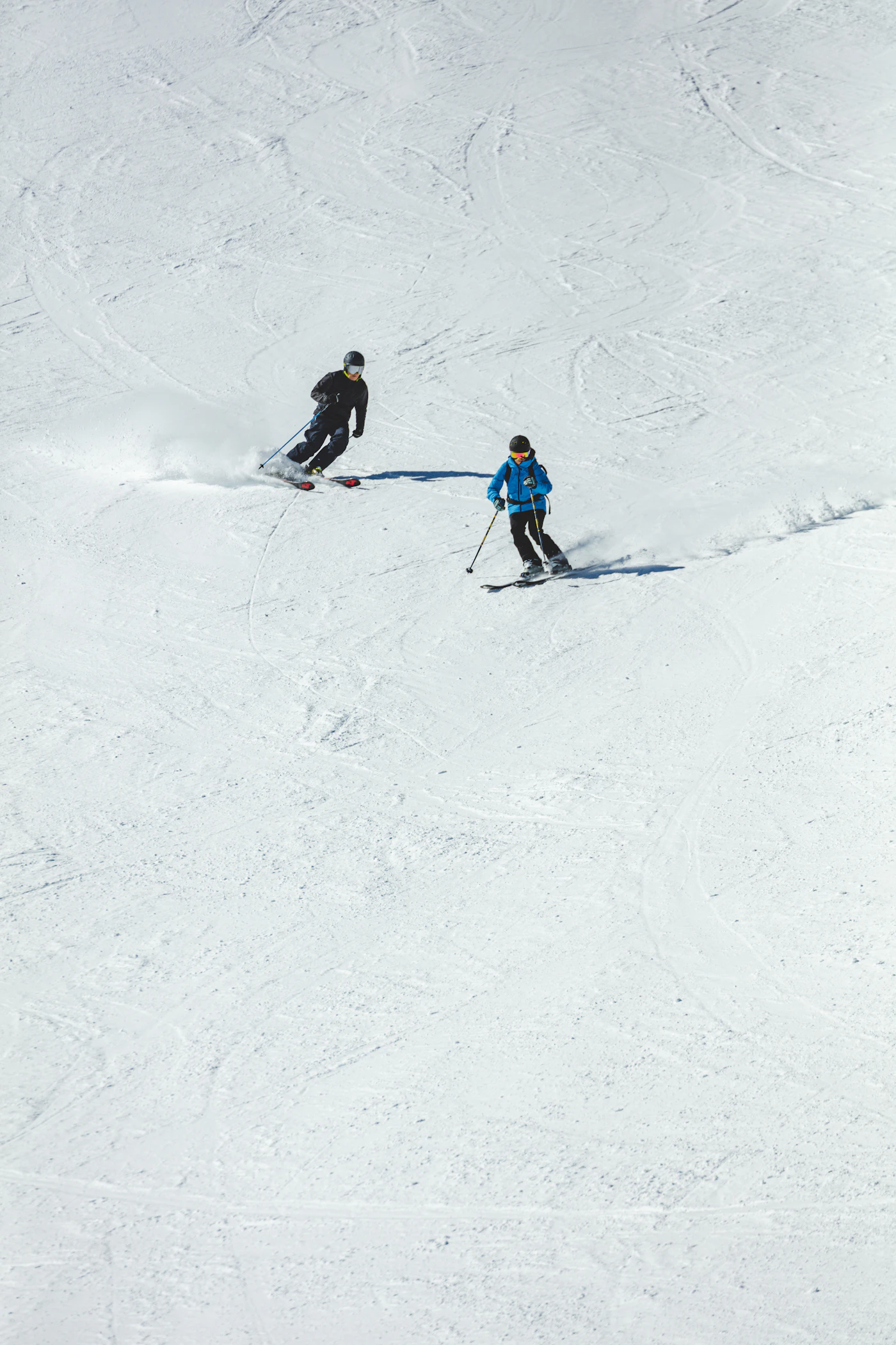 Skier carving through fresh powder