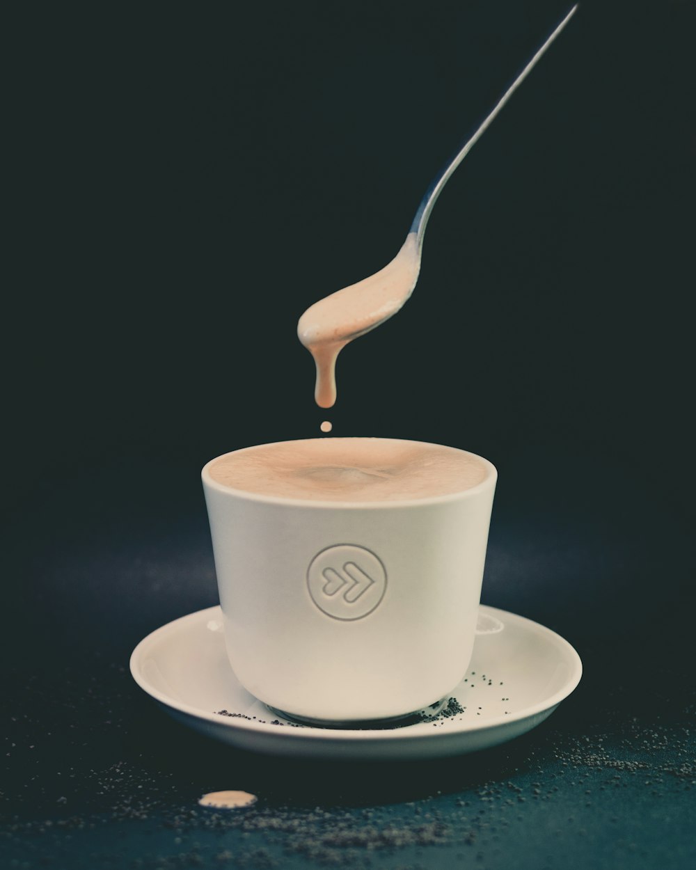 white ceramic cup with saucer