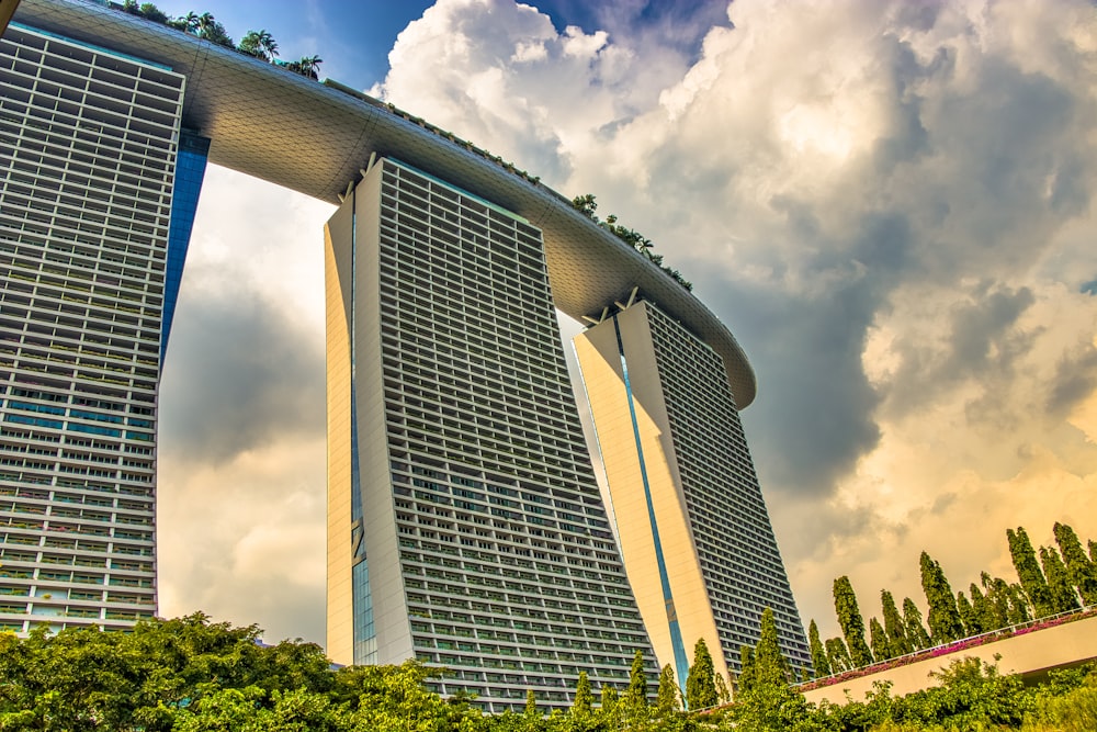 white and blue concrete building under white clouds during daytime