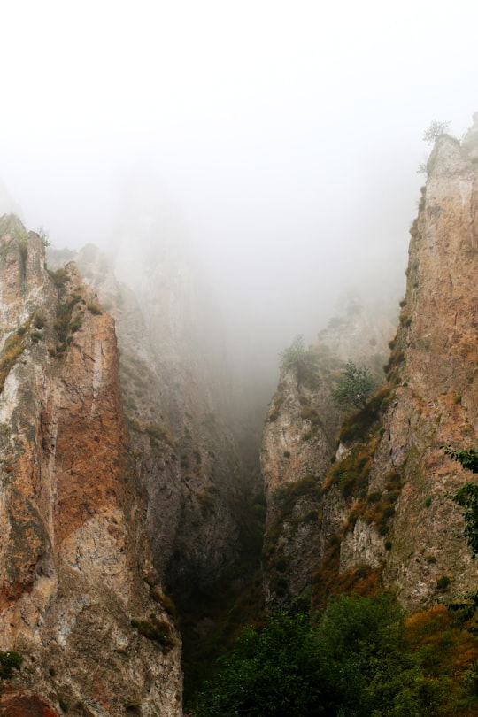 brown rocky mountain with fog in Goris Armenia