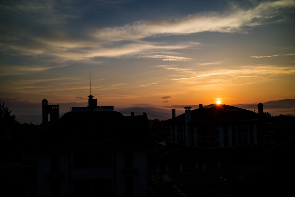 silhouette of buildings during sunset