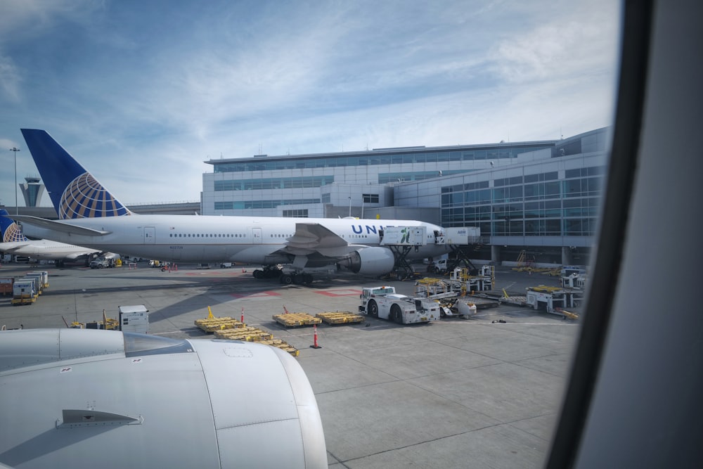 white passenger plane on airport during daytime