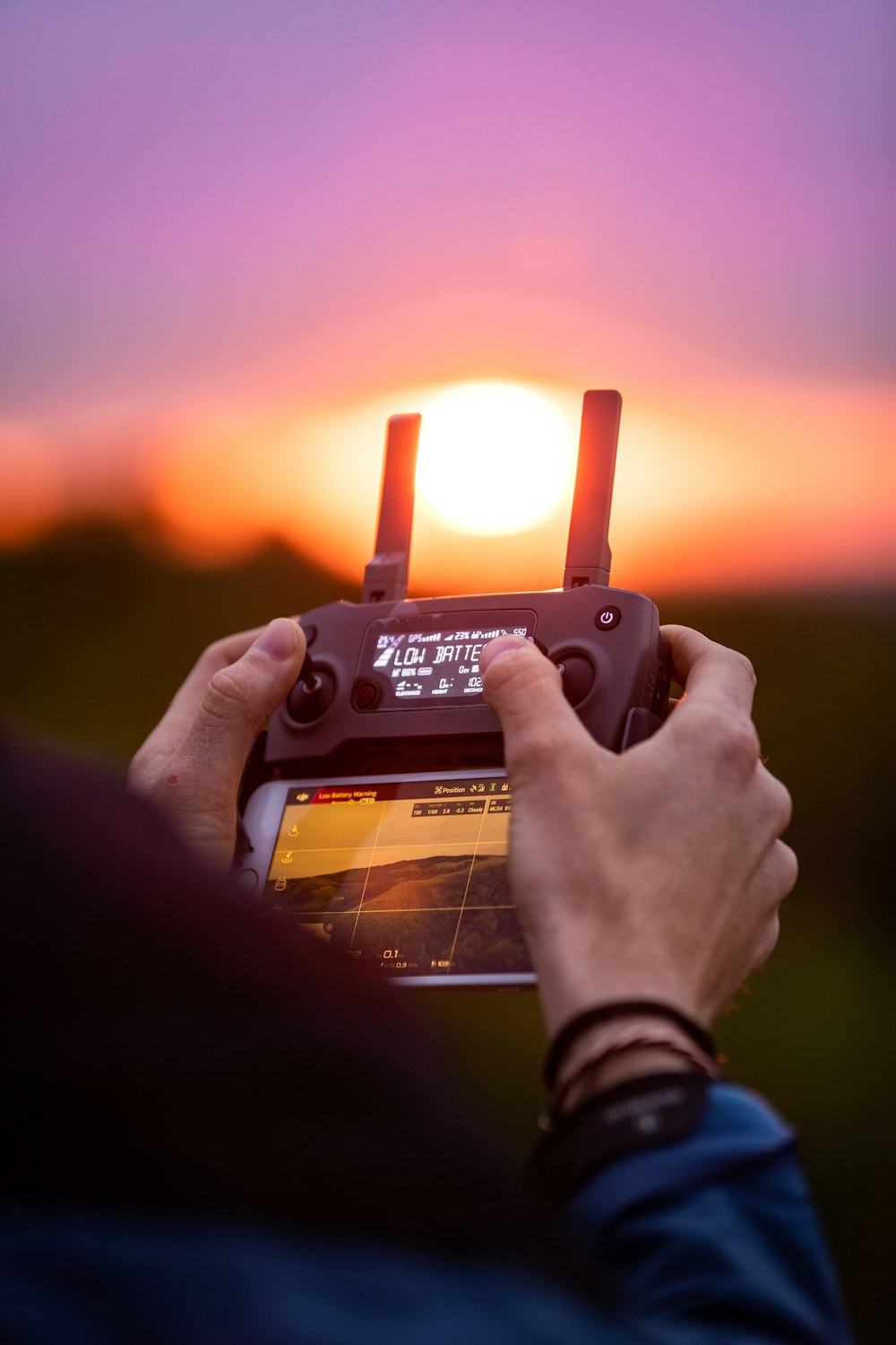 person holding black digital camera