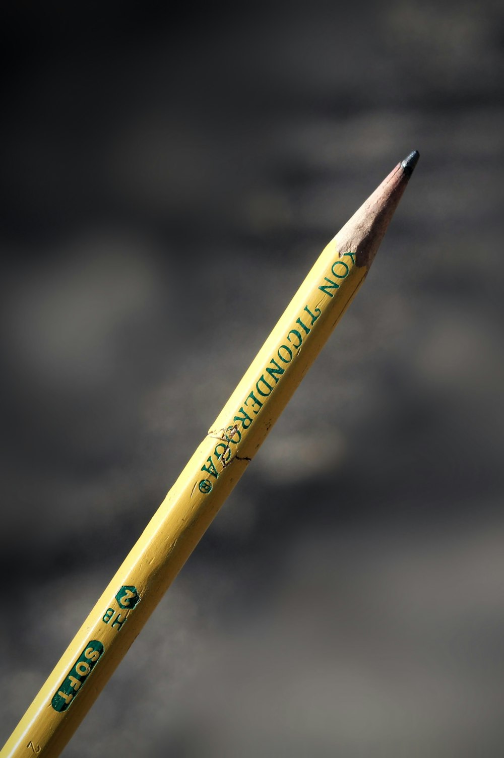 yellow pencil with black background