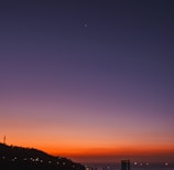 silhouette of city buildings during sunset