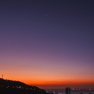 silhouette of city buildings during sunset