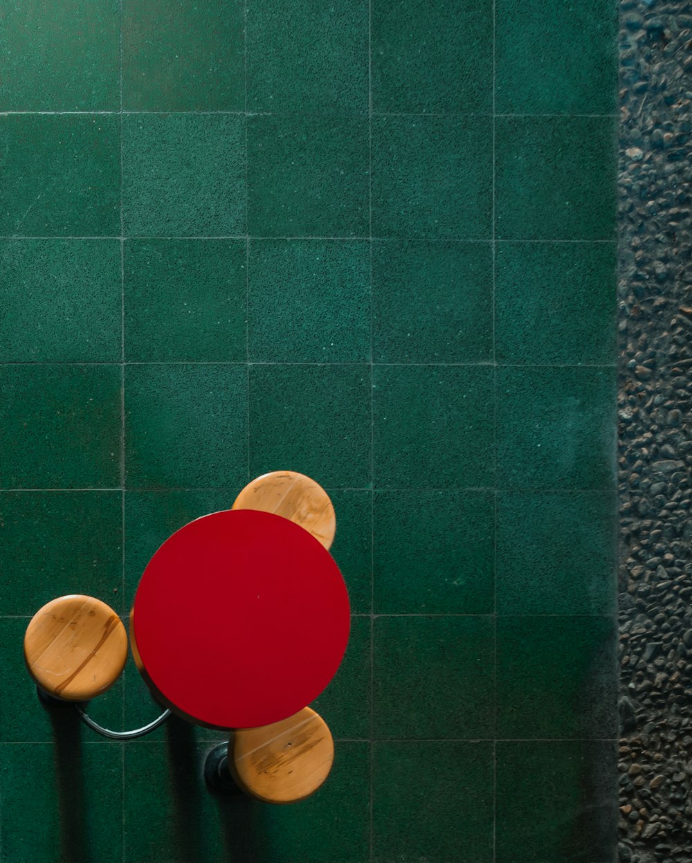 red round plastic lid on green ceramic tile