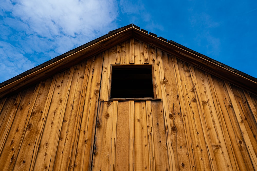 brown wooden house under blue sky