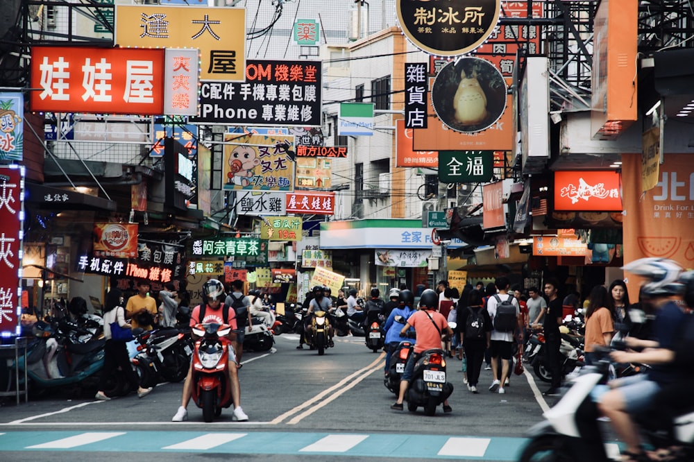 people riding motorcycle on road during daytime