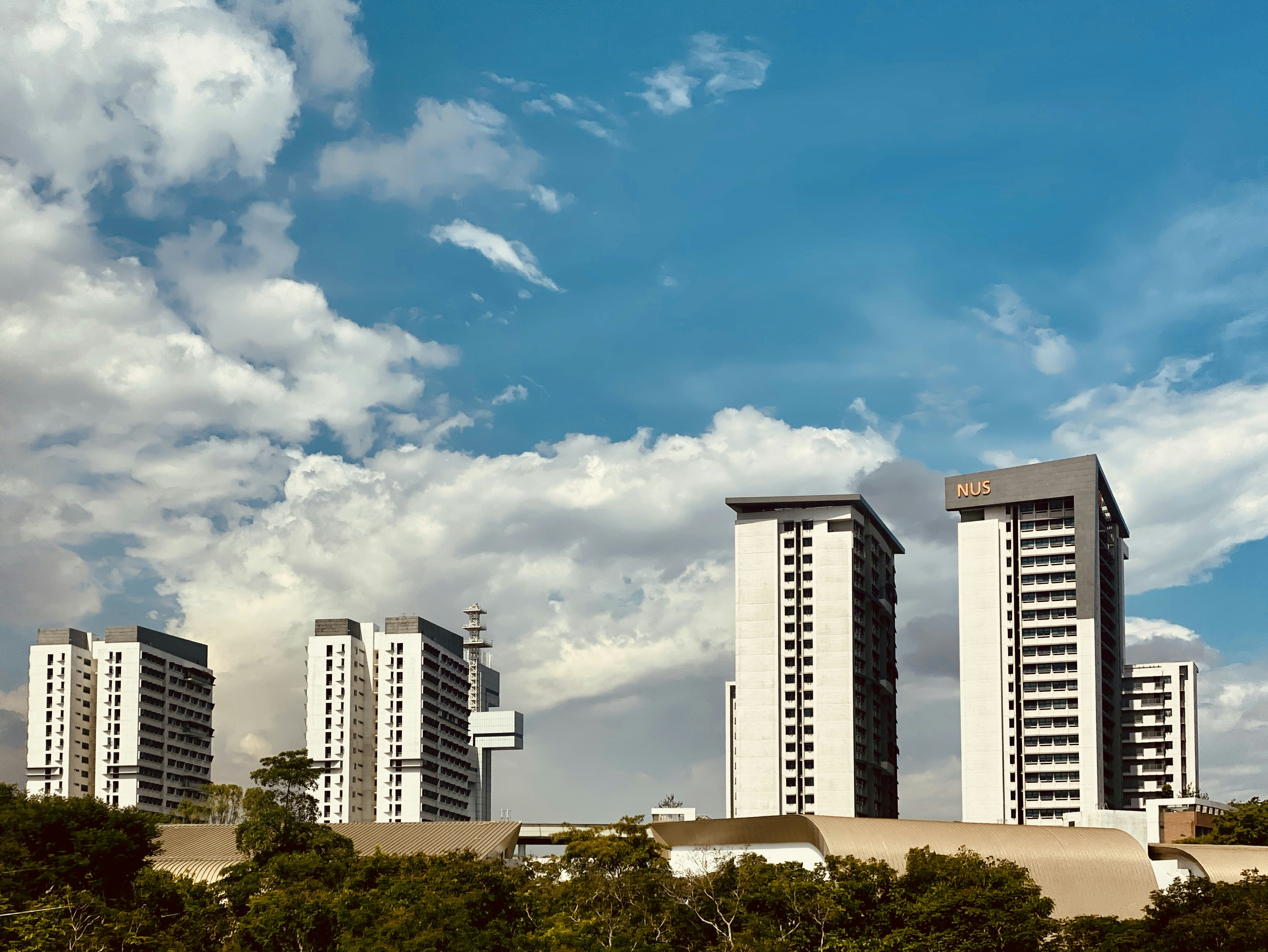 white and blue concrete building under blue sky during daytime