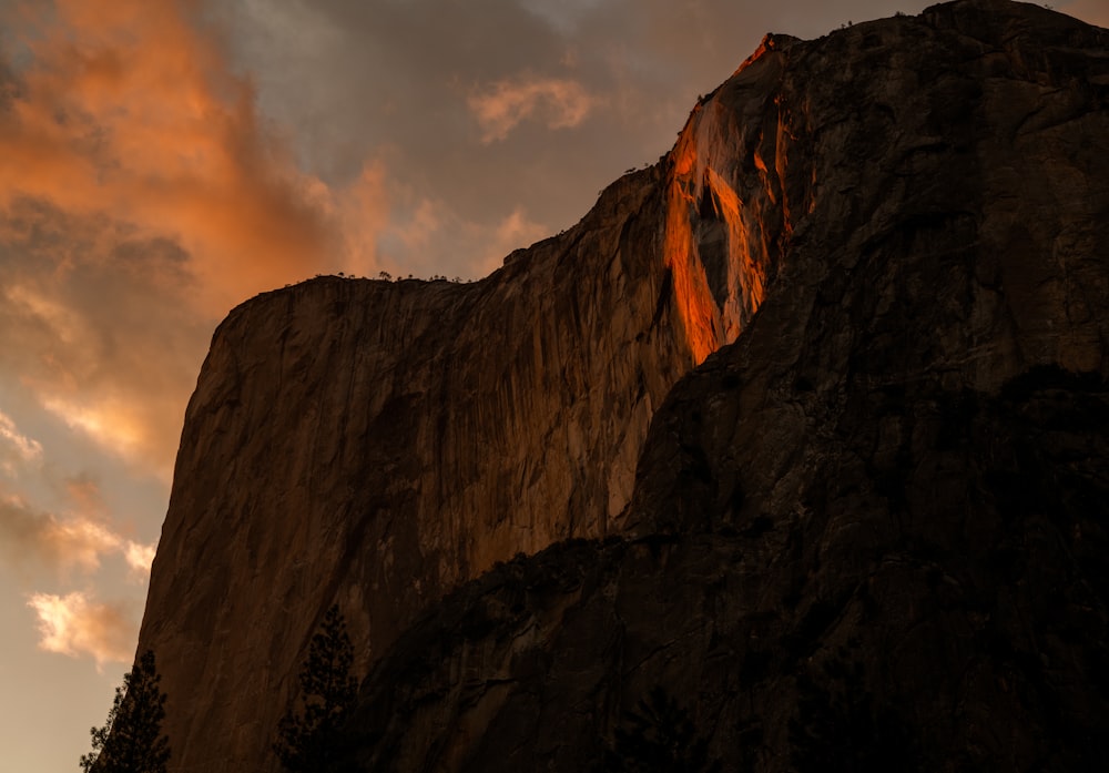 brown rock formation under cloudy sky during daytime