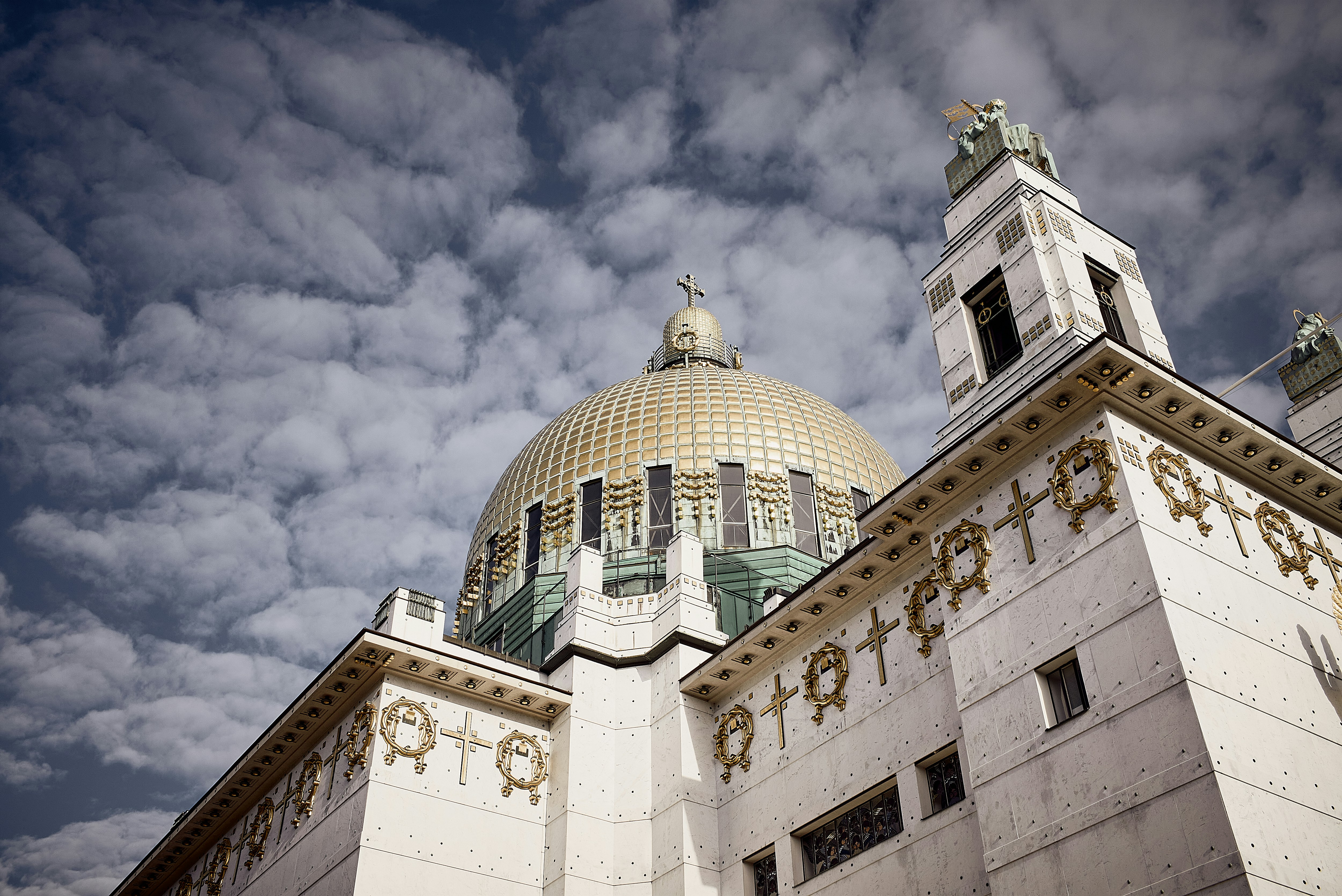 white and green dome building under cloudy sky during daytime