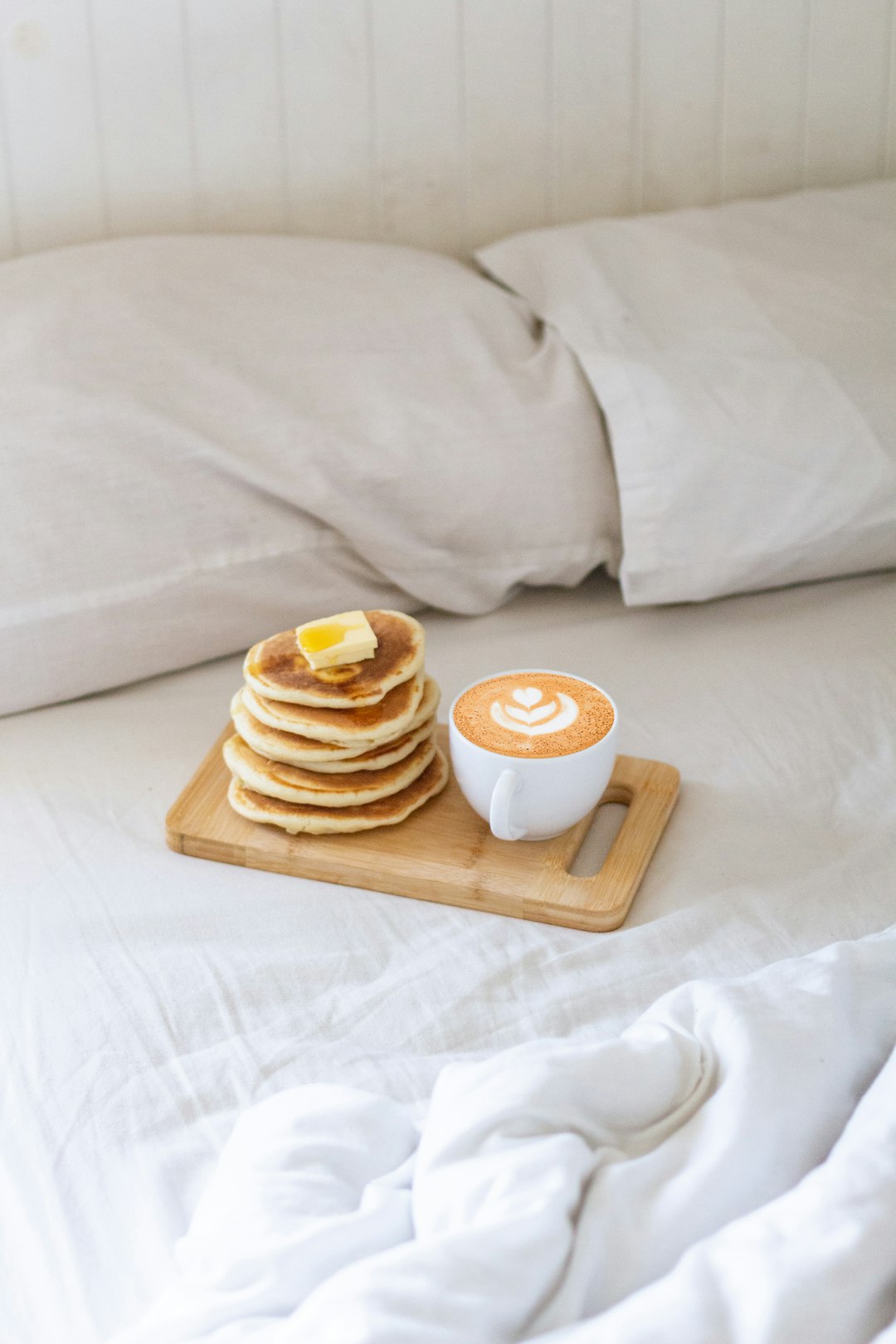 white ceramic mug on brown wooden tray