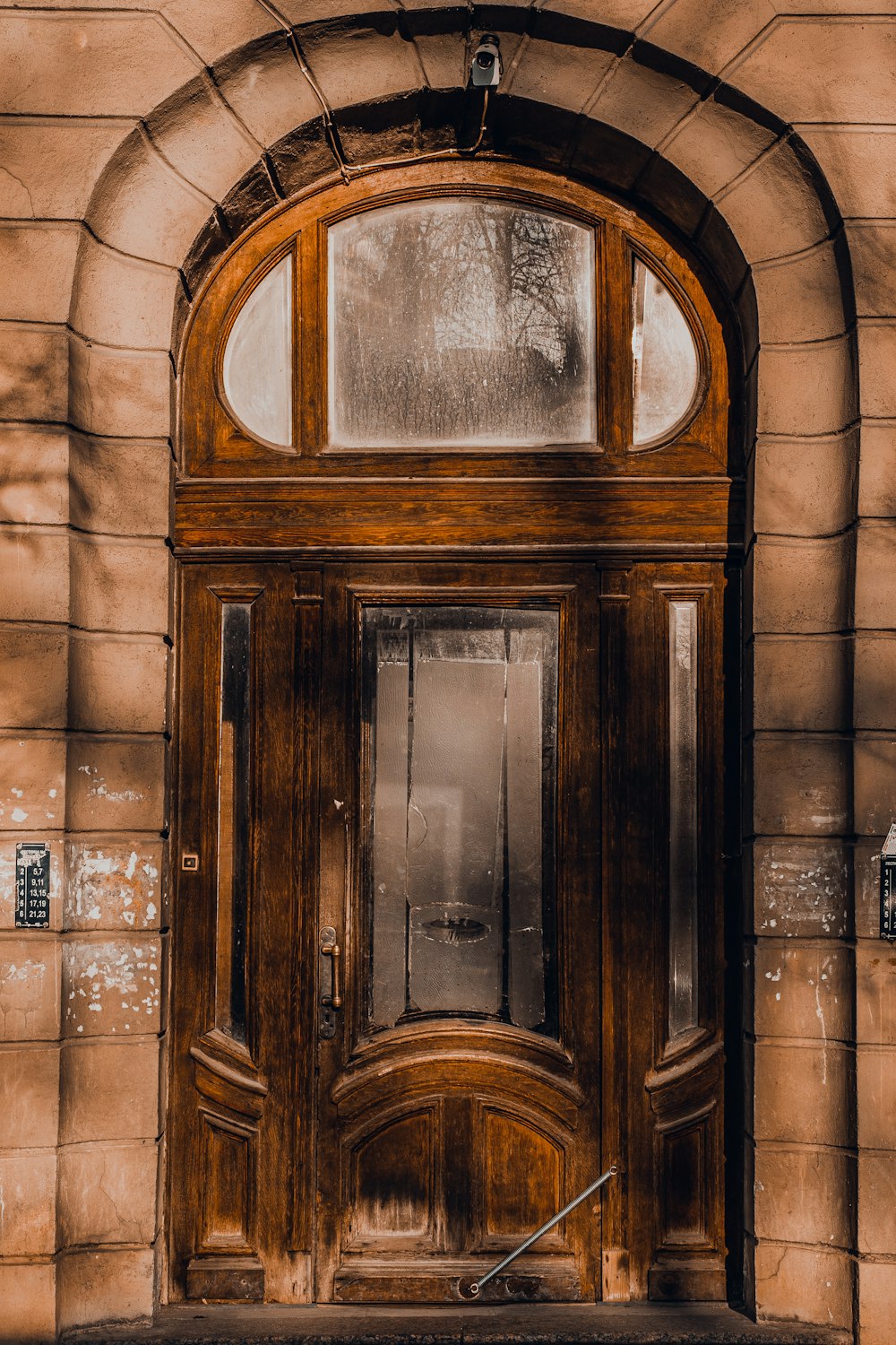 brown wooden door with glass