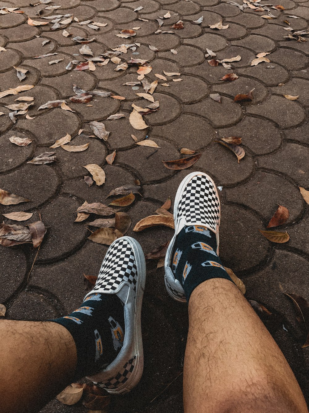 person wearing blue and white sock and white and black sneakers