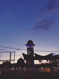 A peaceful mosque silhouette against a twilight sky, capturing the essence of monotheistic faith.