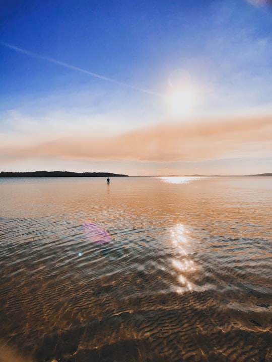 body of water under blue sky during daytime in Nelson Bay New South Wales Australia