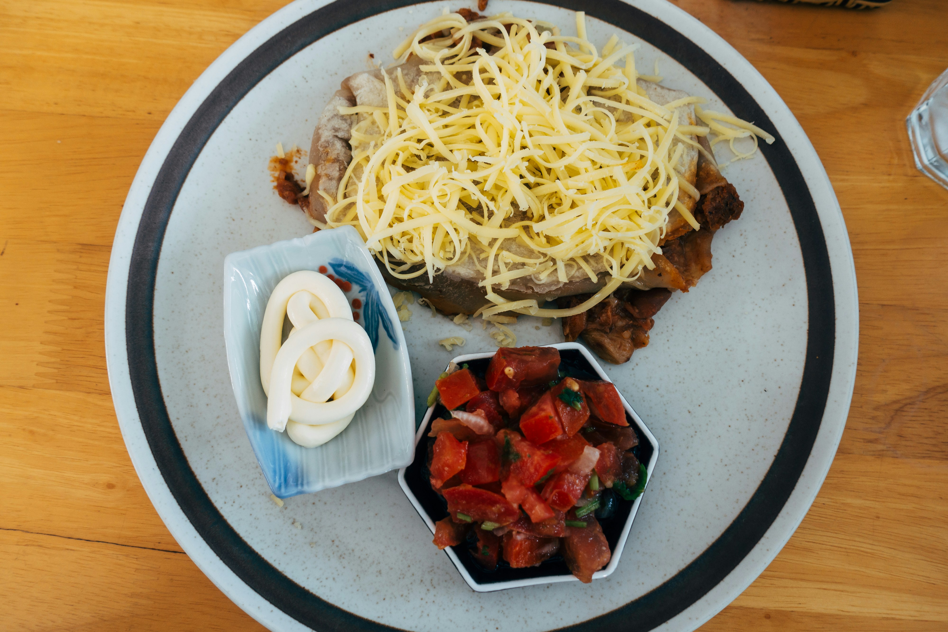 Enchilada plate with cheese and salsa
