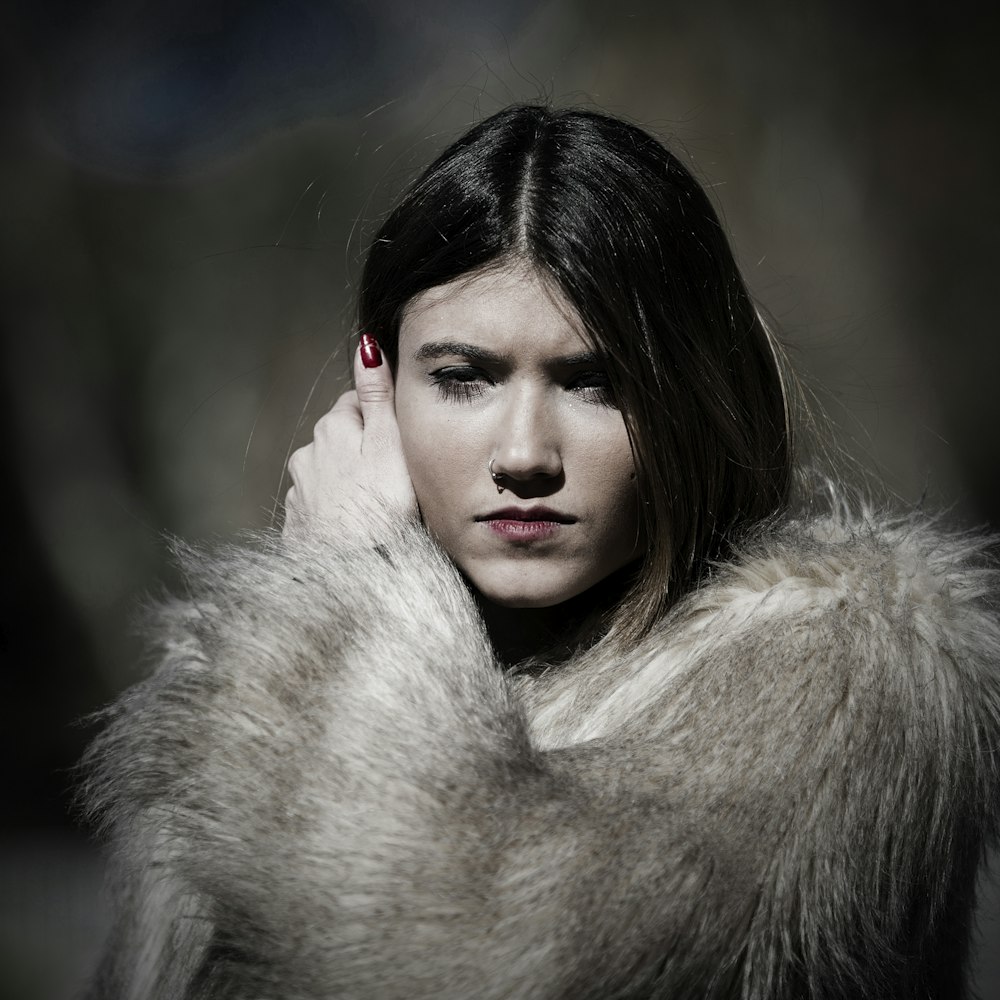 woman in white fur coat