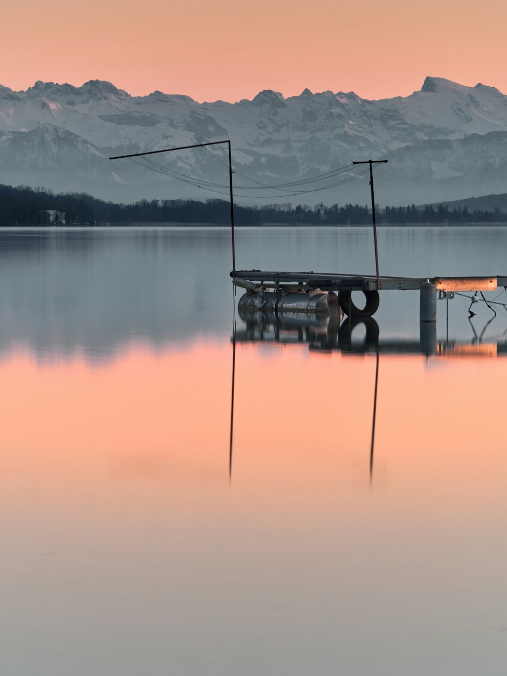 black and white boat on lake during daytime