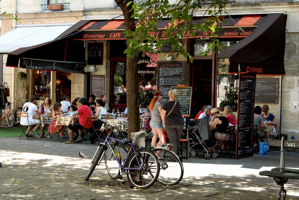 people sitting on chair near building during daytime