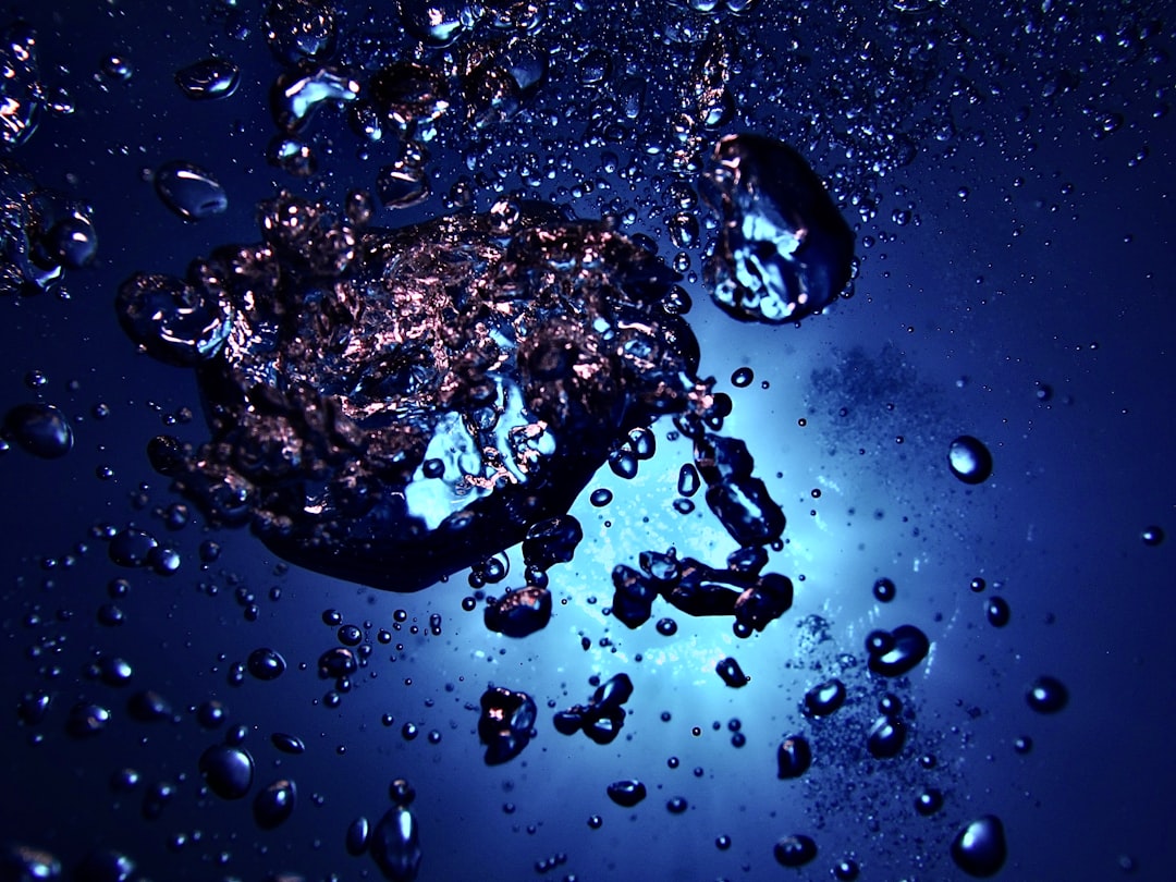 water droplets on black stone