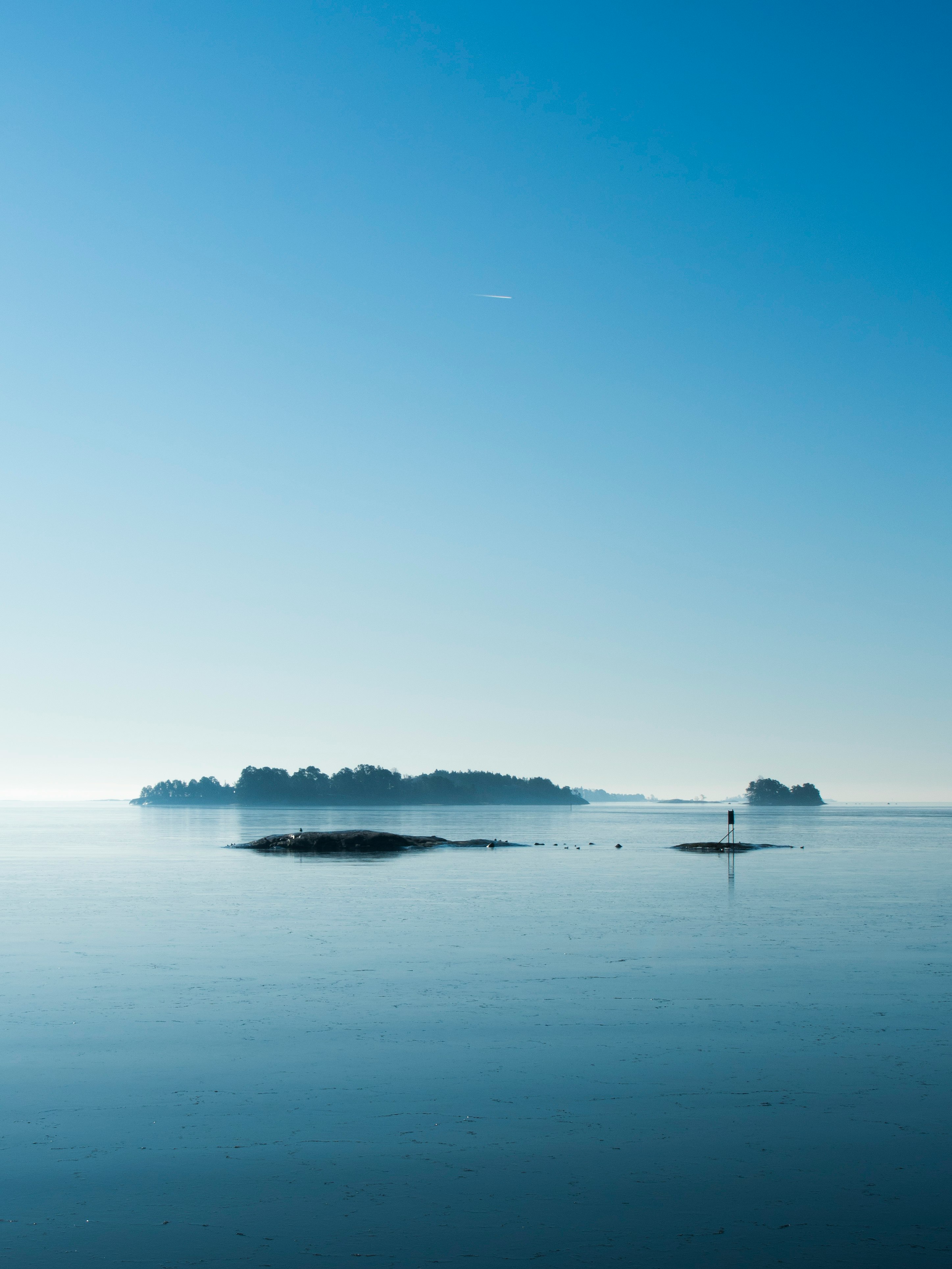 body of water under blue sky during daytime