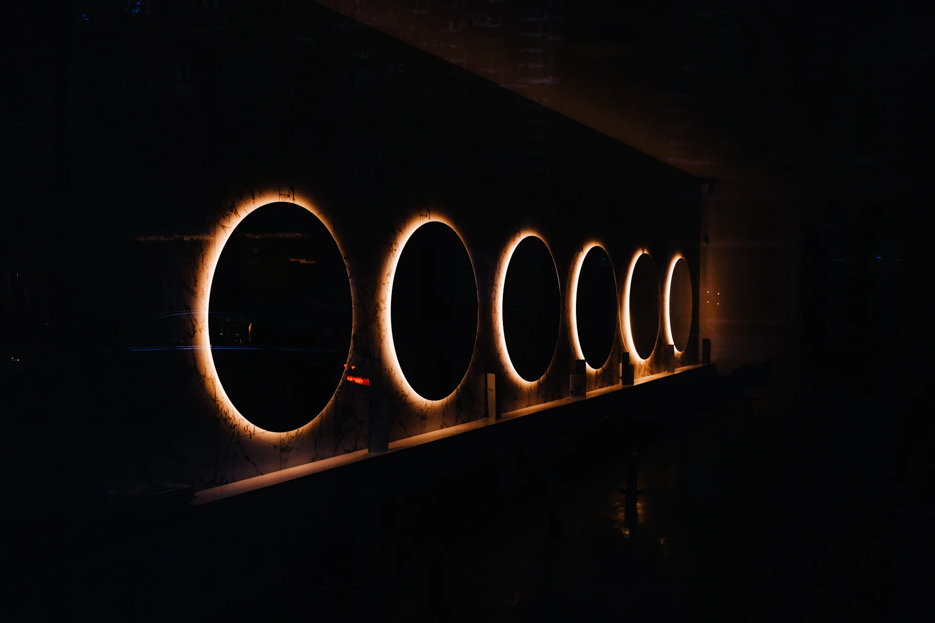 grayscale photo of tunnel with light