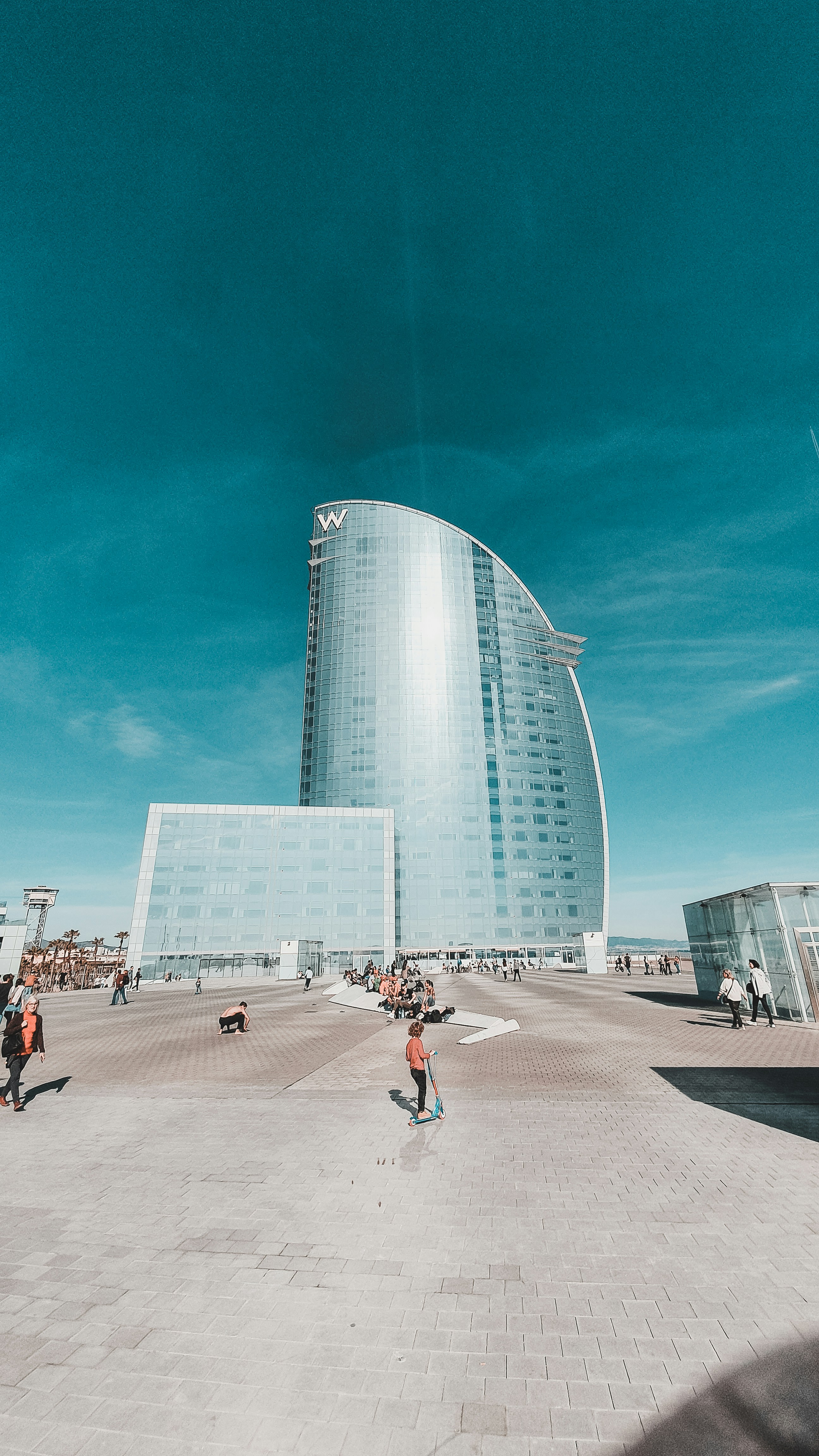 people walking on street near high rise building during daytime