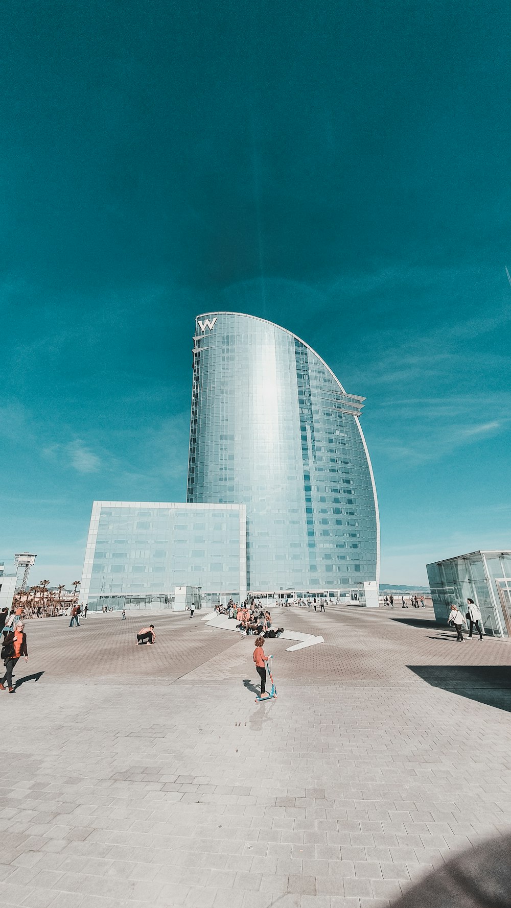 people walking on street near high rise building during daytime