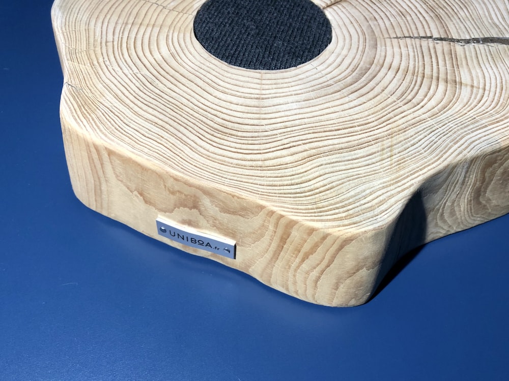 brown wooden table on blue textile