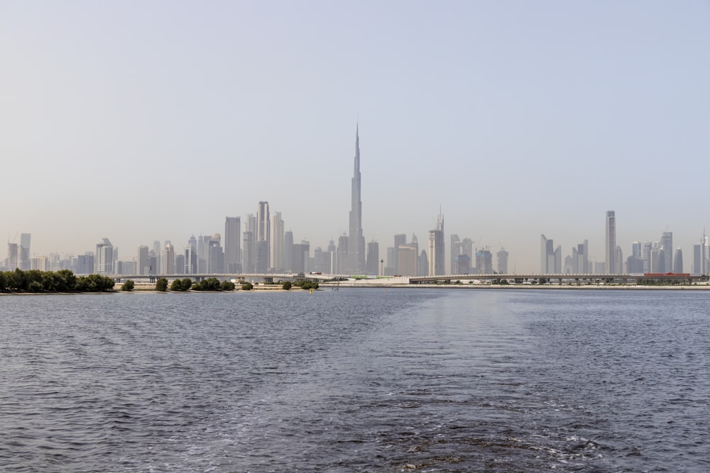 city skyline across body of water during daytime