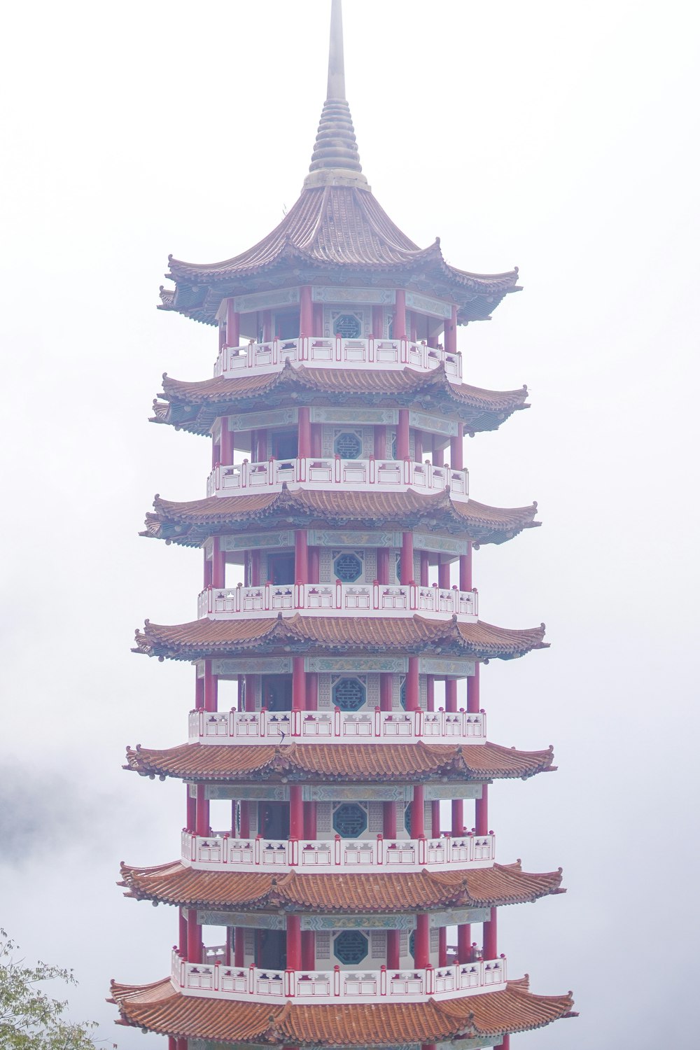 red and white temple under white sky