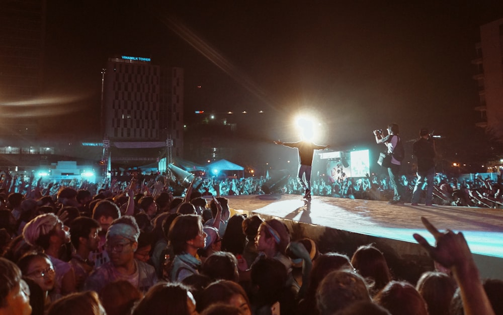 people watching concert during night time