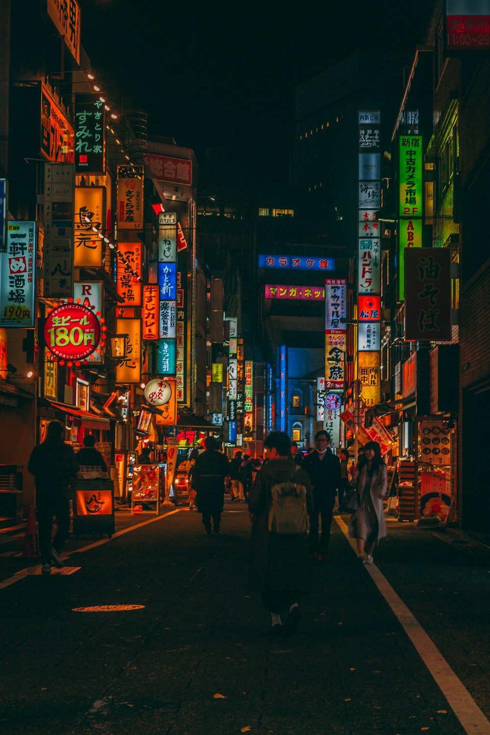 people walking on street during night time