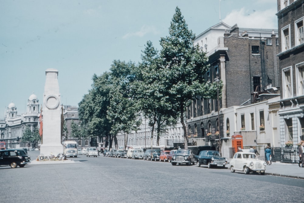 cars parked on side of the road near building during daytime