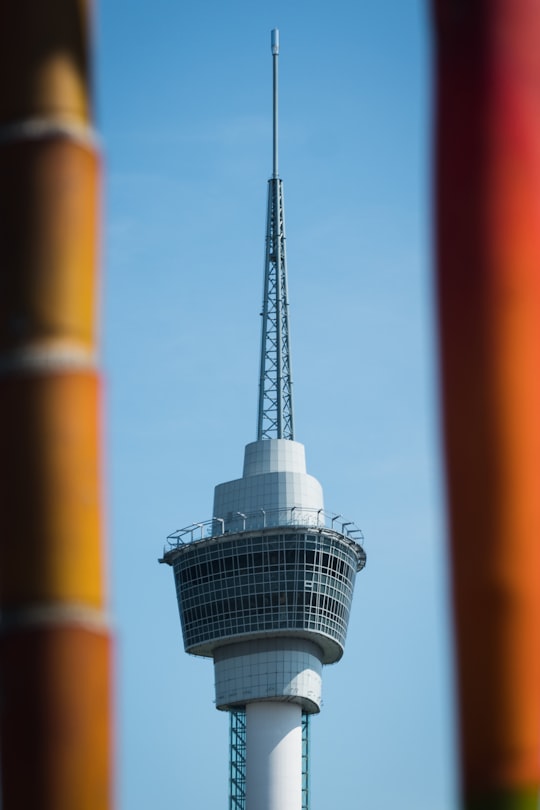 white and black tower under blue sky during daytime in Kuantan Malaysia