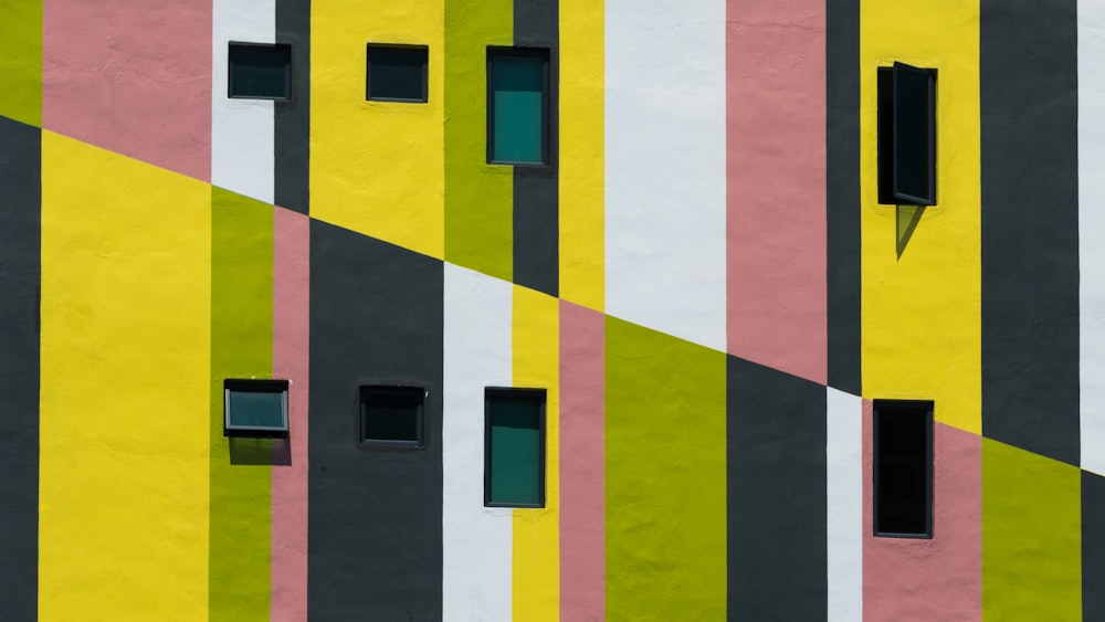 yellow pink and green concrete building